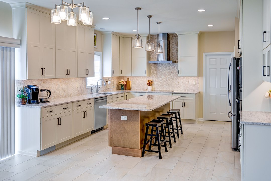 Warm Creamy White Painted Cabinetry Paired Organic Wood-Grained Timber Kitchen Remodel in East York  
